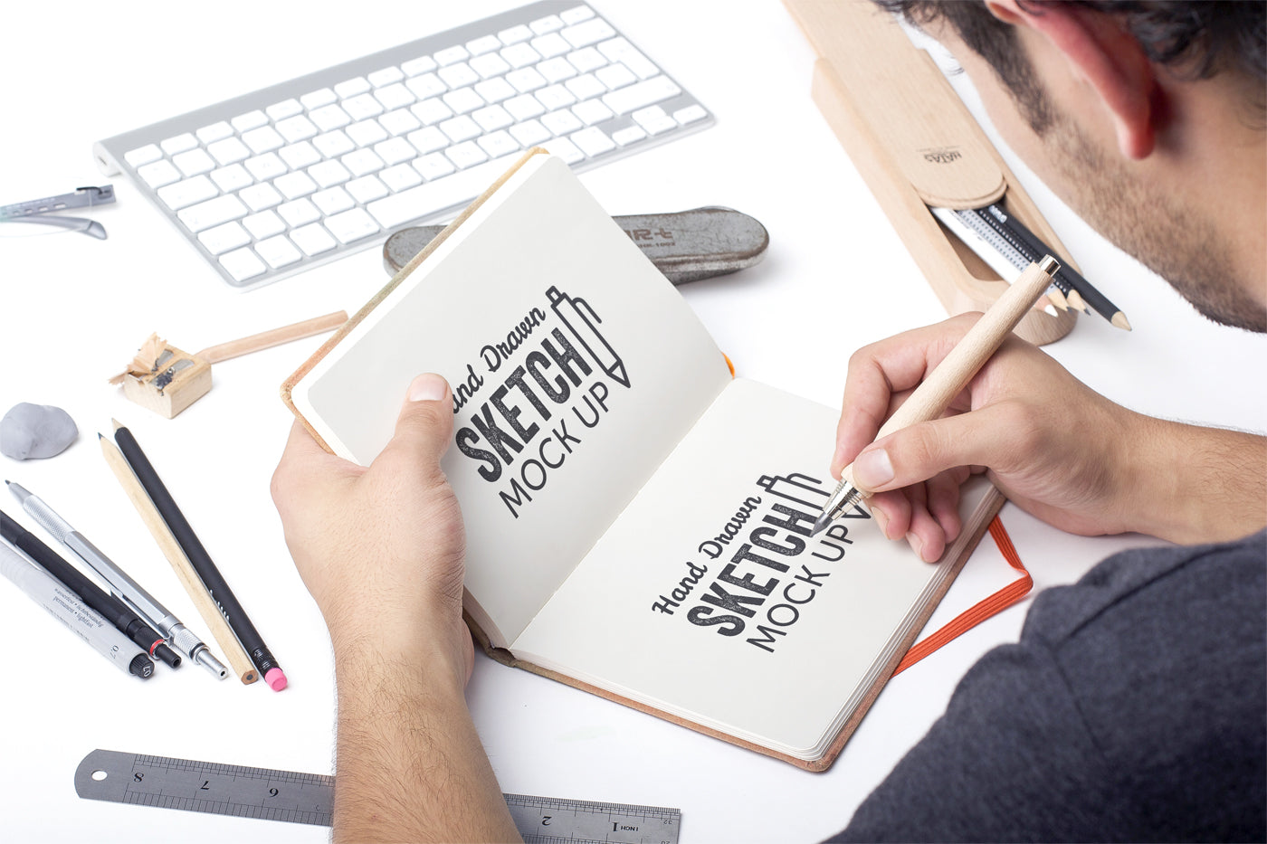 Free Hand Drawn Sketch Mockup with a Man Drawing