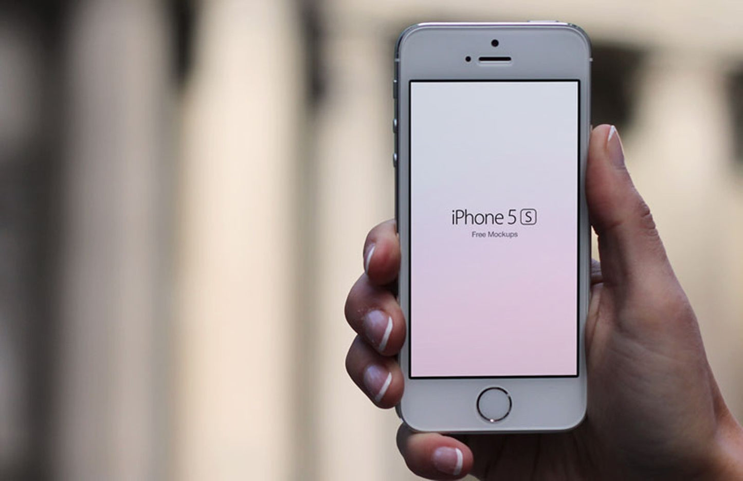 Free Set of iPhone 5S In Hand (Mockup)
