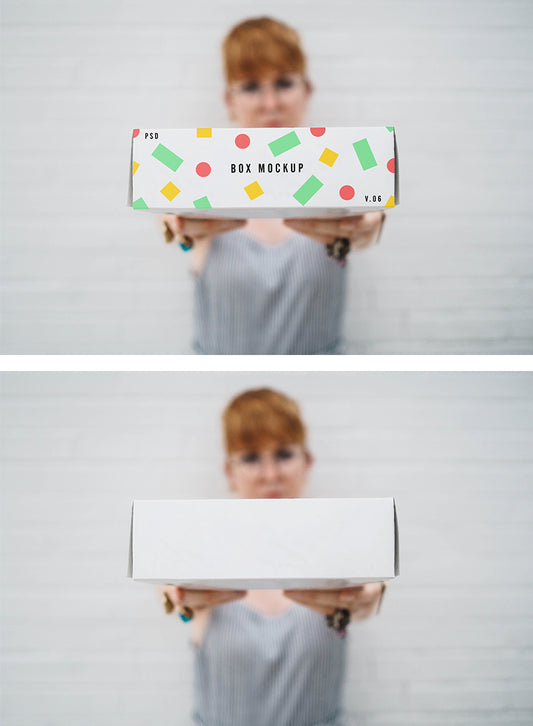Free Woman Holding a Delivery Box (PSD Mockup)