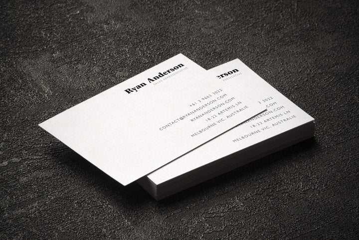 Free Two Business Cards on a Black Surface