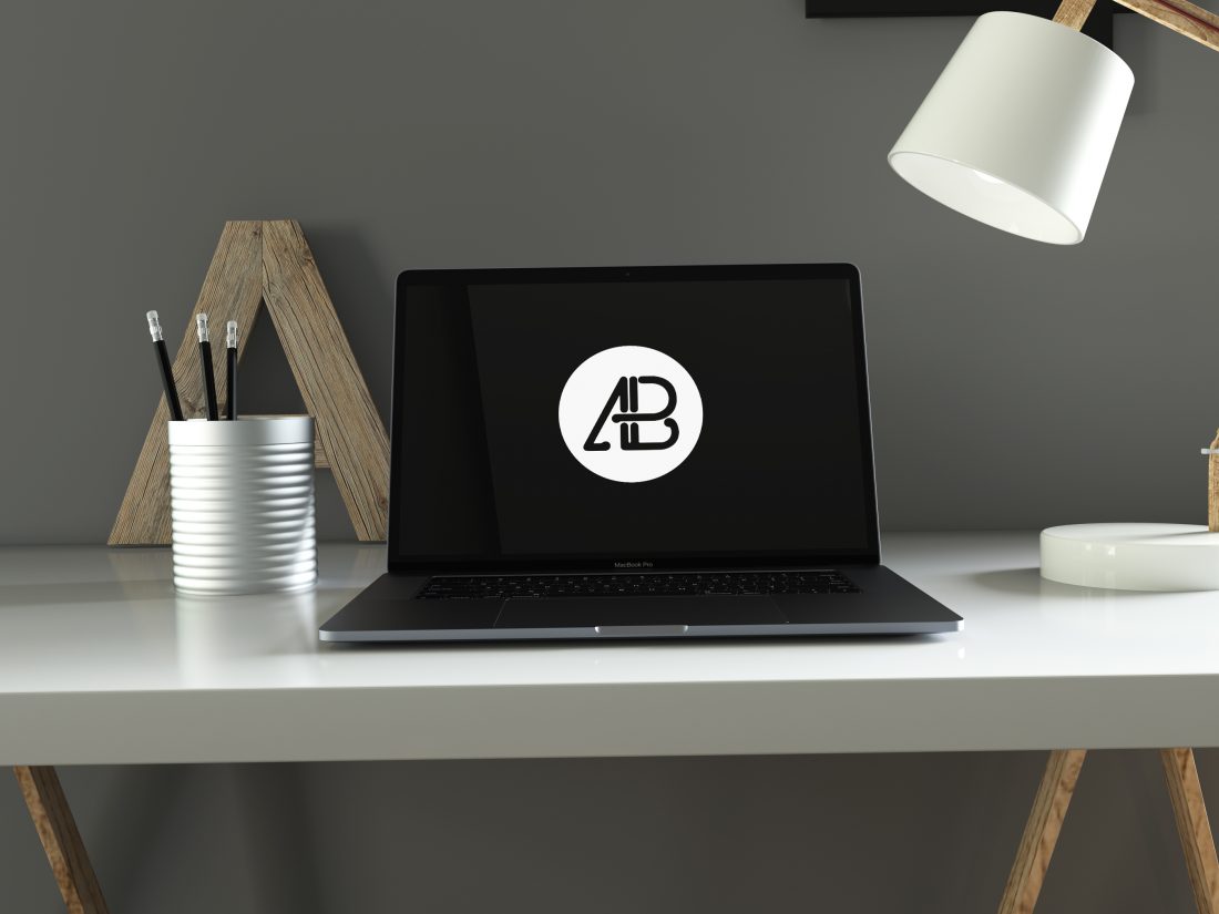 Free Realistic Space Gray Macbook Pro in Home Office Mockup
