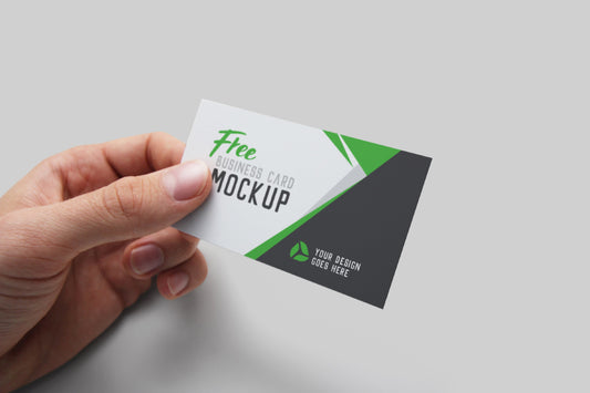 Free Hand Holding Realistic Business Card PSD Mockup