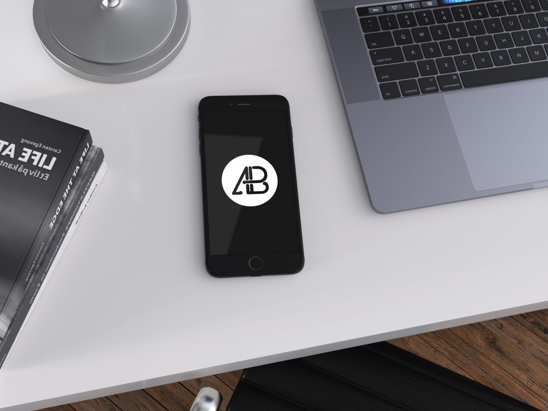 Free Realistic Jet Black iPhone 7 Plus Mockup on Office Table Top View