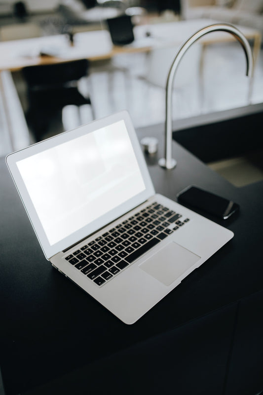 Free A Laptop On A Black Counter