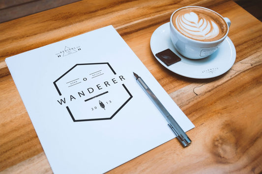 Free A4 Letterhead and Coffee Cup on Table (Mockup)