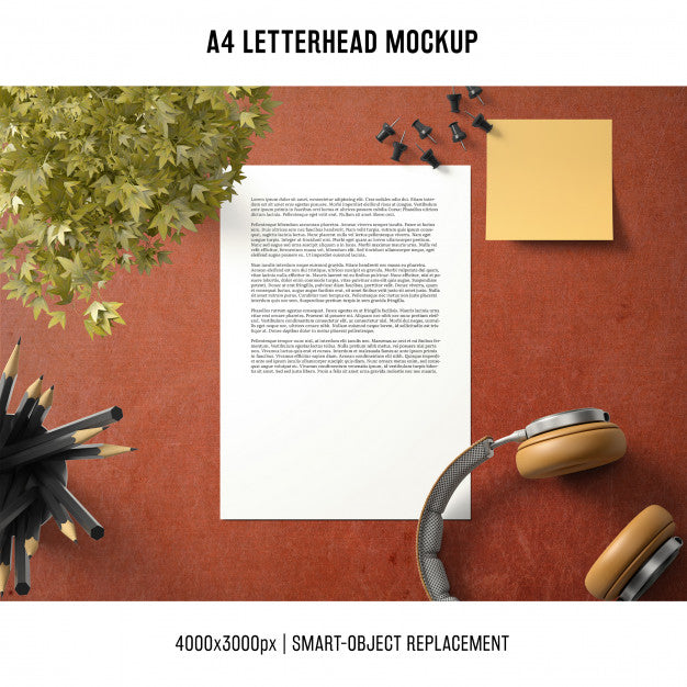 Free A4 Letterhead Mockup With Headphones And Plant Psd