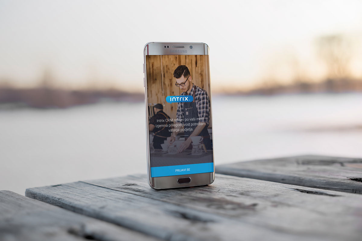 Free Android Smart Phone Mockup on a Wooden Table Outdoors