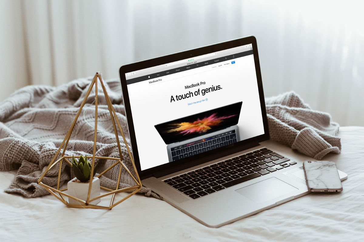 Free Apple Macbook Pro on Bed Mockup