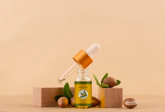 Free Argan Oil Cosmetic Bottle Mock-Up With Wooden-Shaped Podium And Kernels Psd