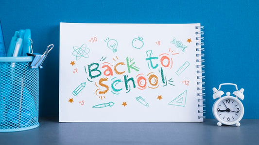 Free Arrangement With Back To School Lettering On Notebook Psd