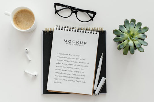 Free Arrangement With Mock-Up Notepad On A Desk Psd