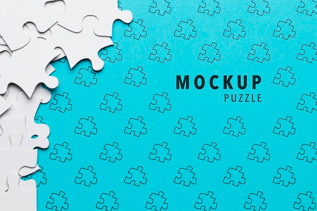 Free Arrangement With Puzzle Pieces On Blue Background Psd
