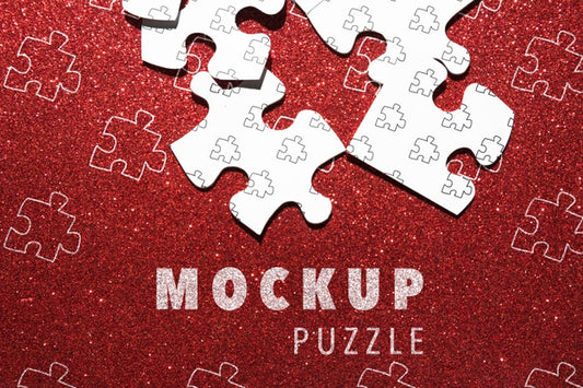 Free Arrangement With Puzzle Pieces On Red Background Psd