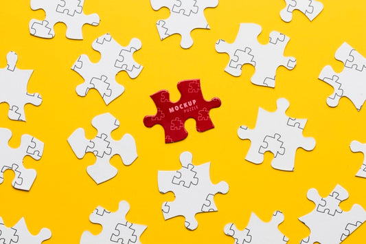 Free Arrangement With Puzzle Pieces On Yellow Background Psd