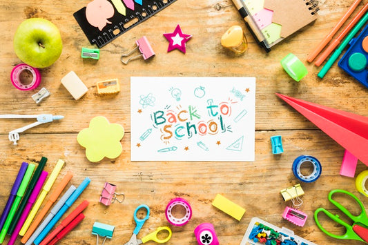 Free Arrangement With Supplies For School On Wooden Background Psd