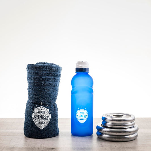 Free Arrangement With Water Bottle And Towel Psd