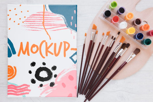 Free Art Studio Colourful Mock-Up With Brushes Top View Psd