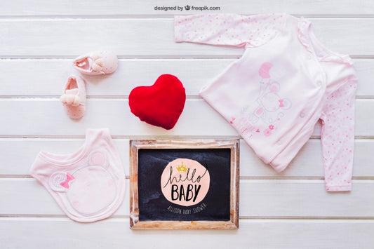 Free Baby Mockup With Girl Clothes And Slate Psd