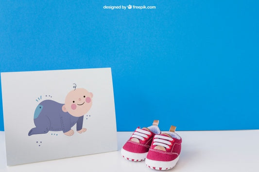 Free Baby Mockup With Paper And A Pair Of Shoes Psd