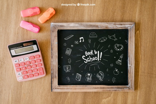 Free Back To School Composition With Slate And Calculator On Wooden Surface Psd