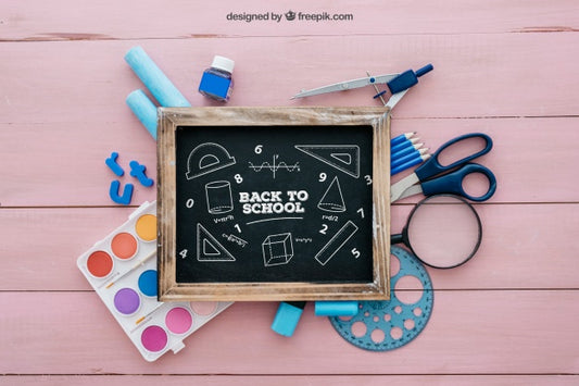 Free Back To School Composition With Slate On Wooden Surface Psd