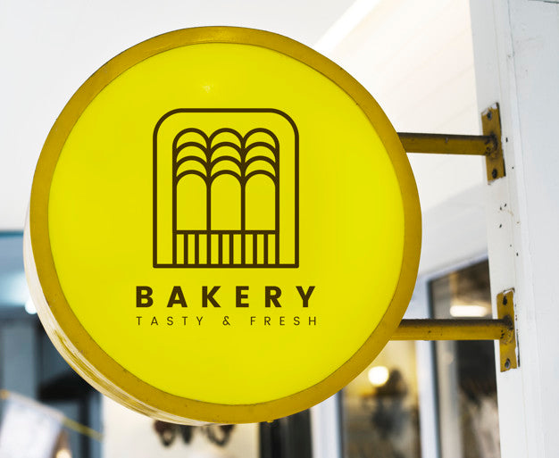 Free Bakery Store'S Yellow Shop Sign Mockup Psd
