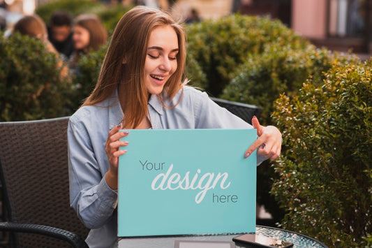 Free Beautiful Blonde Girl Holding A Banner Mock-Up Psd