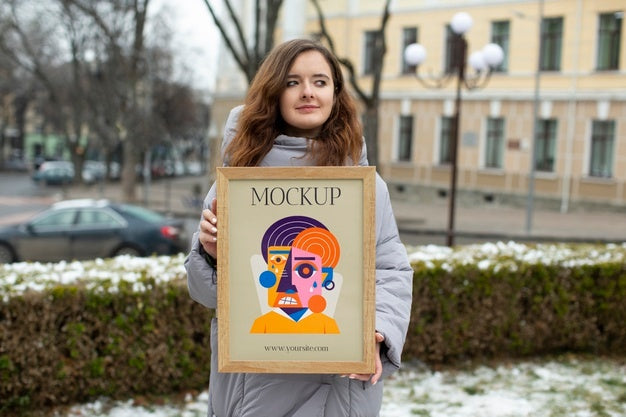 Free Beautiful Frame Model Mockup Held By Girl Psd – CreativeBooster