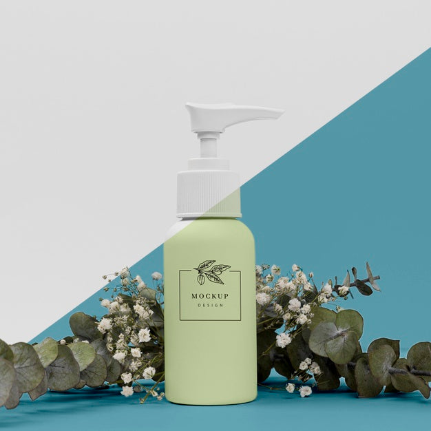 Free Beauty Product Bottle With Plant Mock-Up Psd