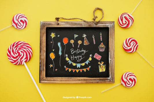 Free Birthday Concept With Lollipops And Slate Psd