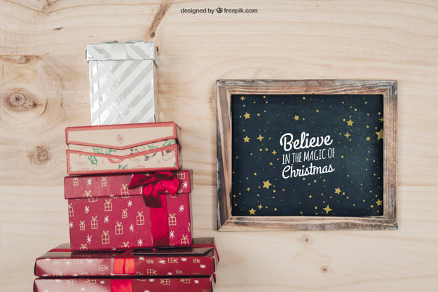 Free Blackboard And Gift Boxes Mockup With Christmtas Design Psd