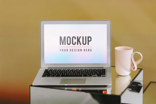 Free Blank Laptop Screen And A Pink Coffee Cup Psd