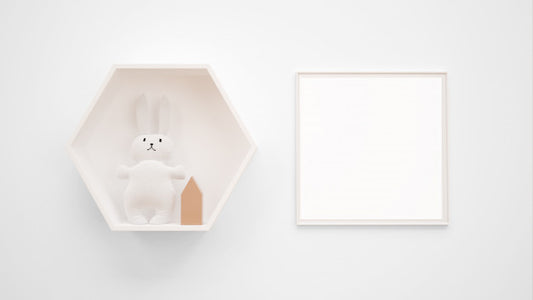 Free Blank Photo Frame Mockup Hanging On The Wall Next To A Bunny Toy Psd