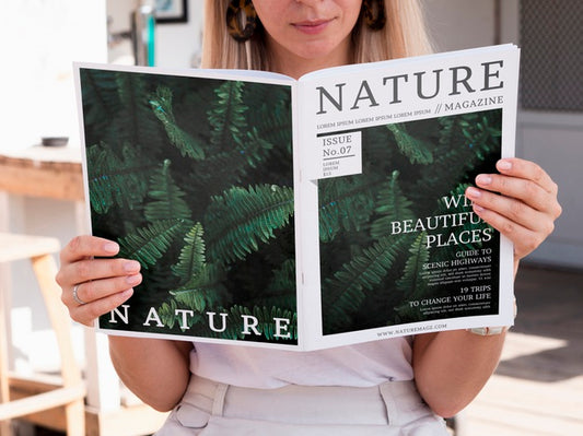 Free Blonde Woman Looking Into A Nature Magazine Mock Up Psd