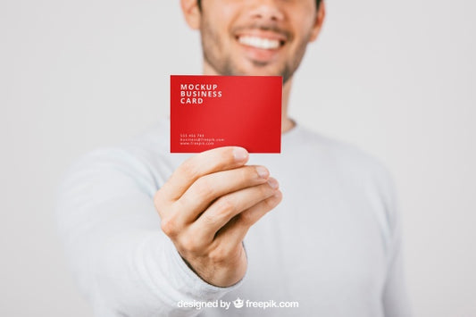Free Blurred Man With Business Card In Foreground Psd