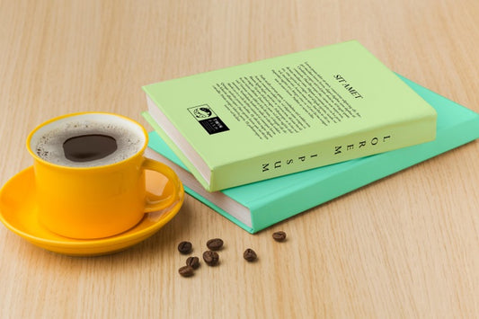 Free Book Cover Arrangement On Wooden Background With Cup Of Coffee Psd