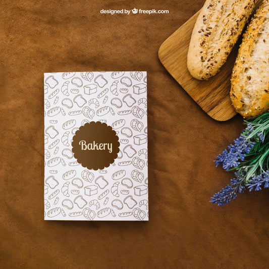 Free Book Cover Mockup With Bread And Flowers Psd