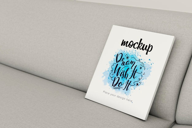 Free Book Mock-Up On Sofa Indoors Psd