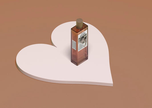 Free Bottle Of Perfume Seated On Heart Shape Psd