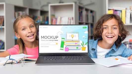 Free Boy And Girl In Library With Mock-Up Laptop Psd