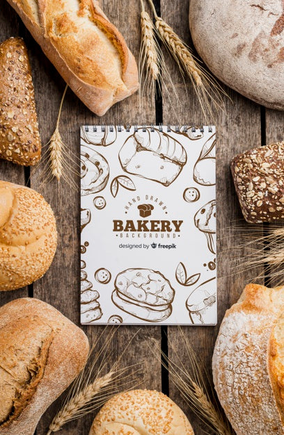 Free Bread And Notebook On Table Psd