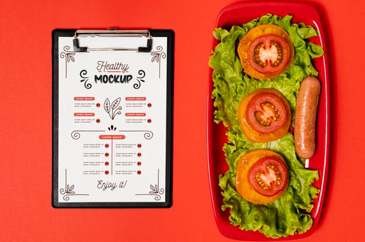 Free Breakfast With Clipboard And Slices Of Tomatoes Psd