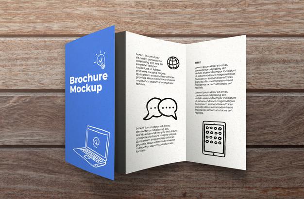 Free Brochure Mockup On Wooden Surface Psd
