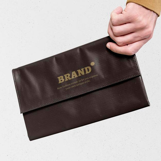 Free Brown Clutch Bag Mockup Held By A Woman Hand Psd