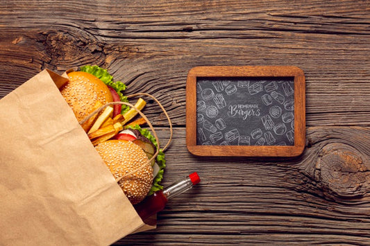 Free Burger Menu In Paper Bag On Wooden Background And Frame Wooden Background Psd