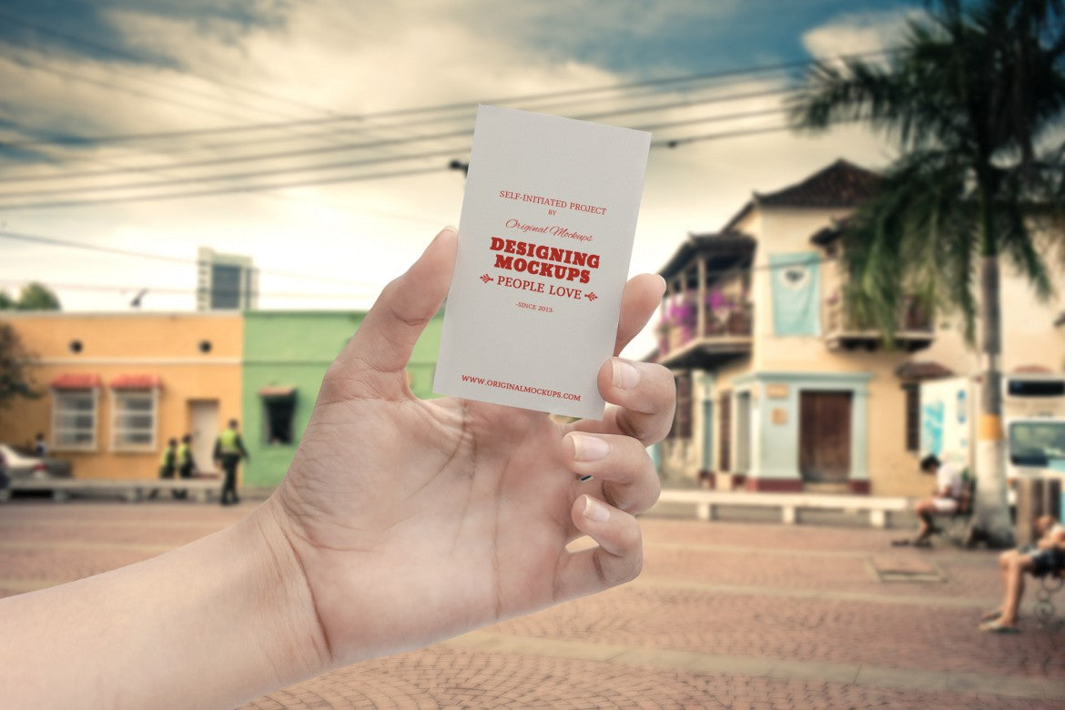 Free Empty White Business Card in Hand (Mockup)