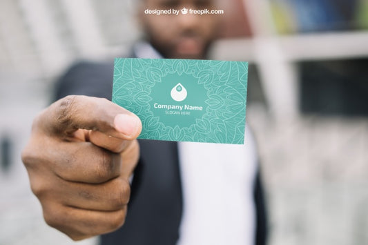 Free Business Card Mockup With Blurred Businessman Psd
