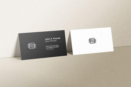 Free Business Cards Laying On A Wall Mockup Psd
