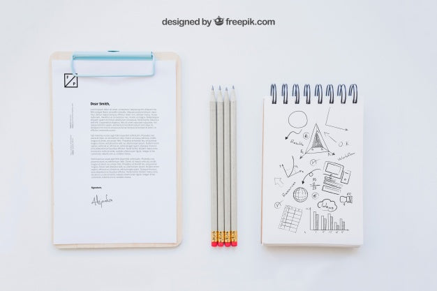 Free Business Composition With Clipboard, Pencils And Notebook Psd