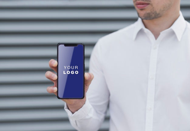 Free Business Man Holding Smartphone Mock-Up Psd